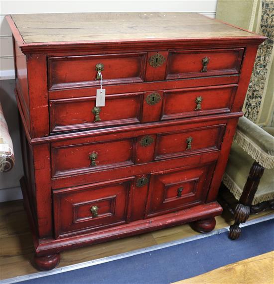 A 17th century and later red painted chest, W.105cm